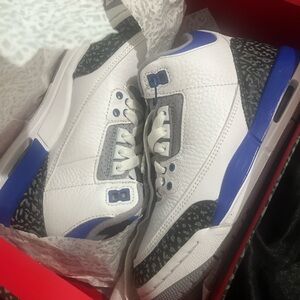 White and Blue Sneakers with Black Accents